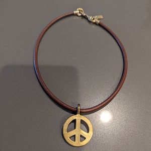 Coach Brown leather choker with detachable peace sign.